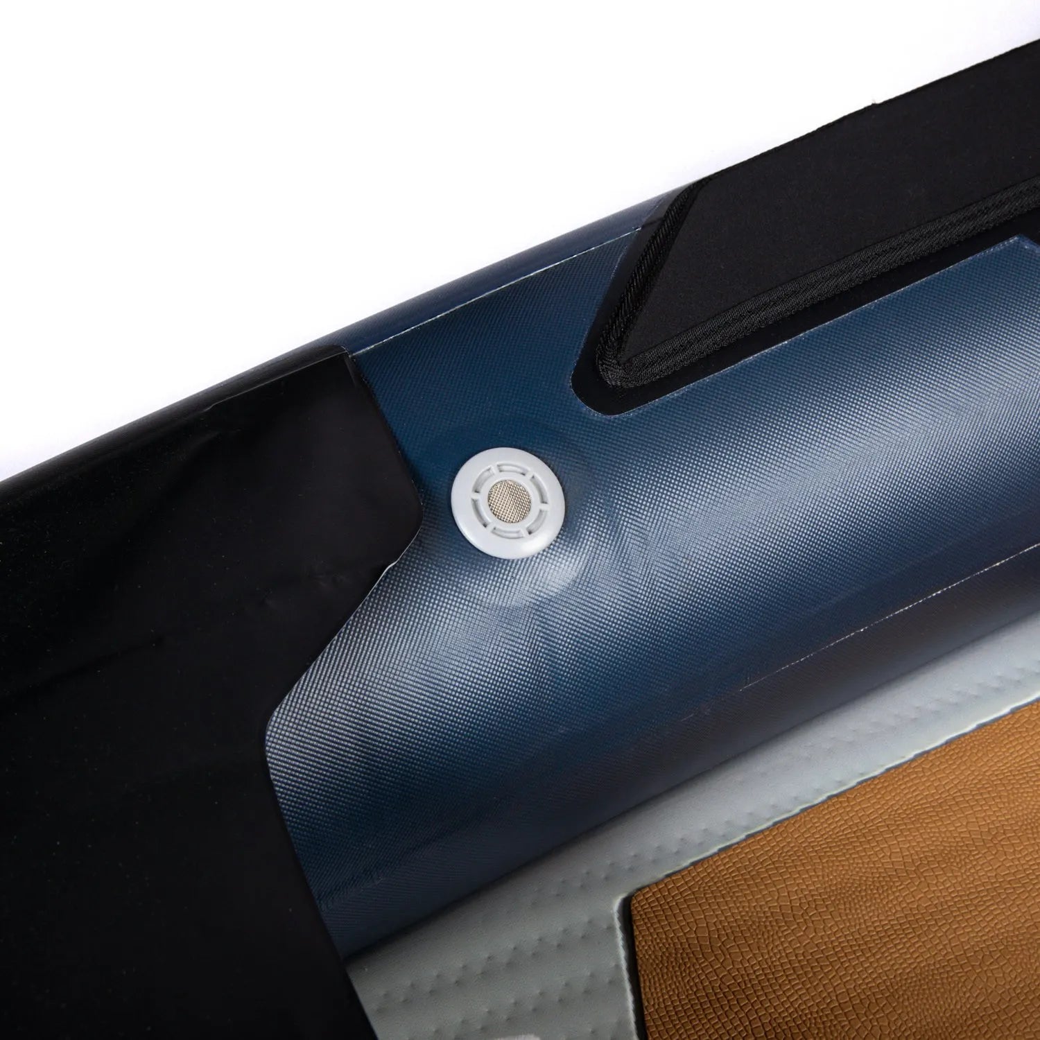 Close-up of a car door with a window control button on a white background