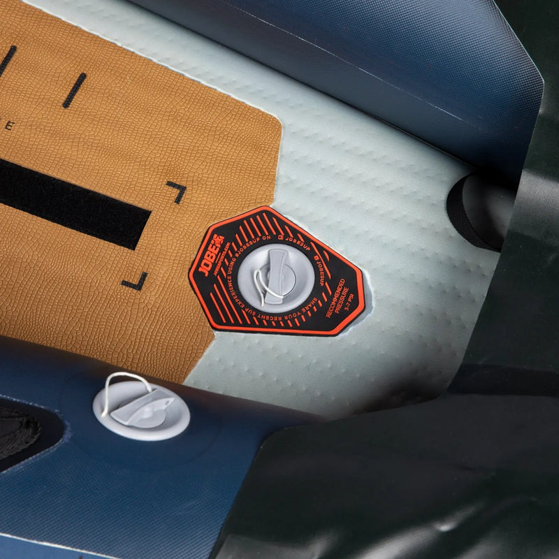 Close-up of a car seat with a logo patch on a textured surface