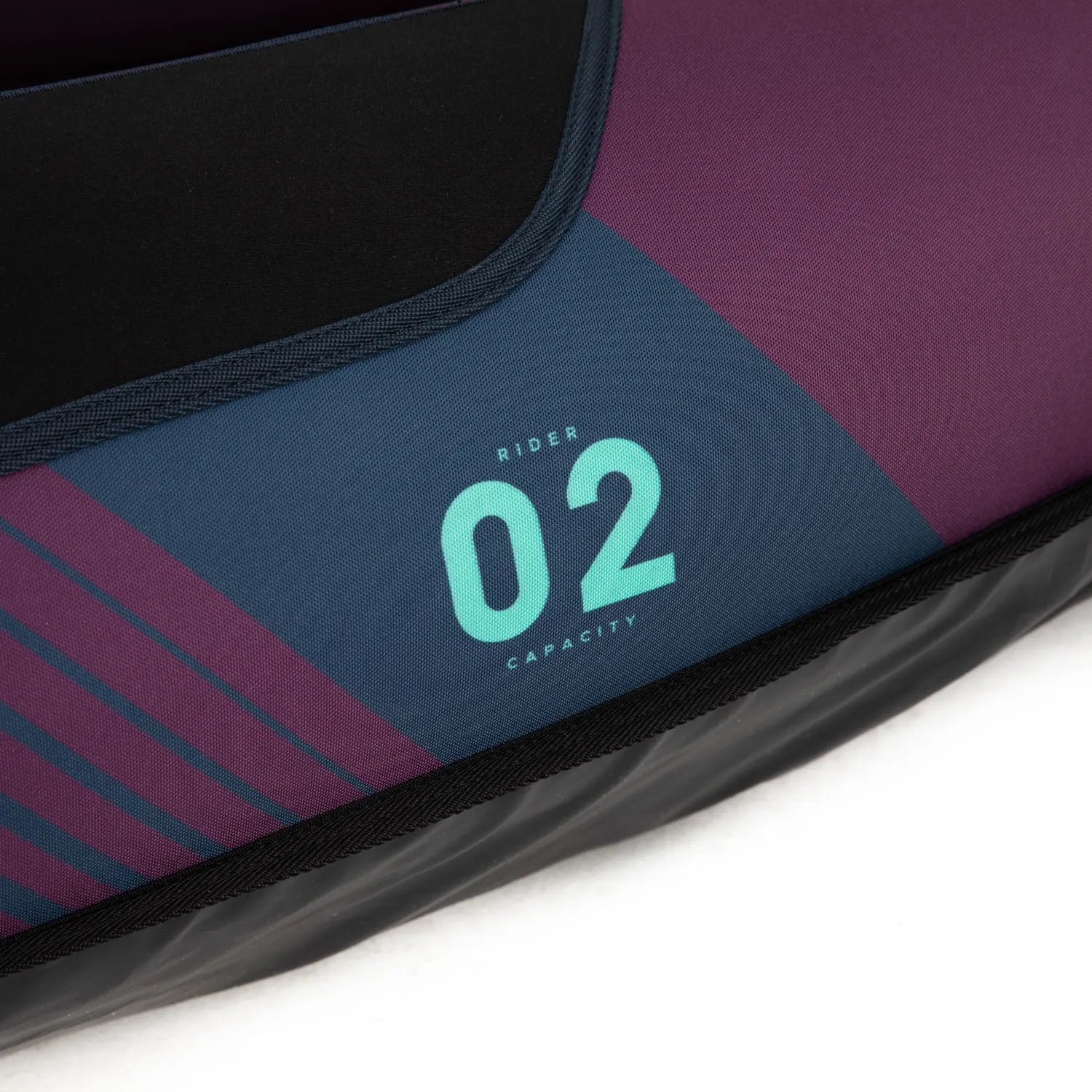 Close-up of a kayak seat with 'Rider Capacity 02' text on a white background