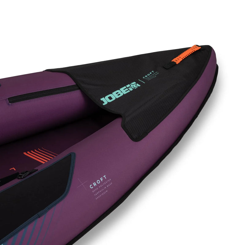 Purple inflatable kayak with black interior and visible branding on a white background