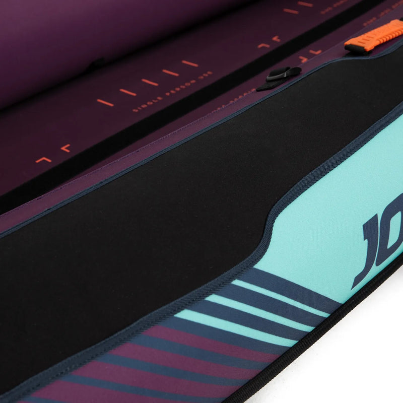 Close-up of a kayak with a colorful design and brand logo on a white background