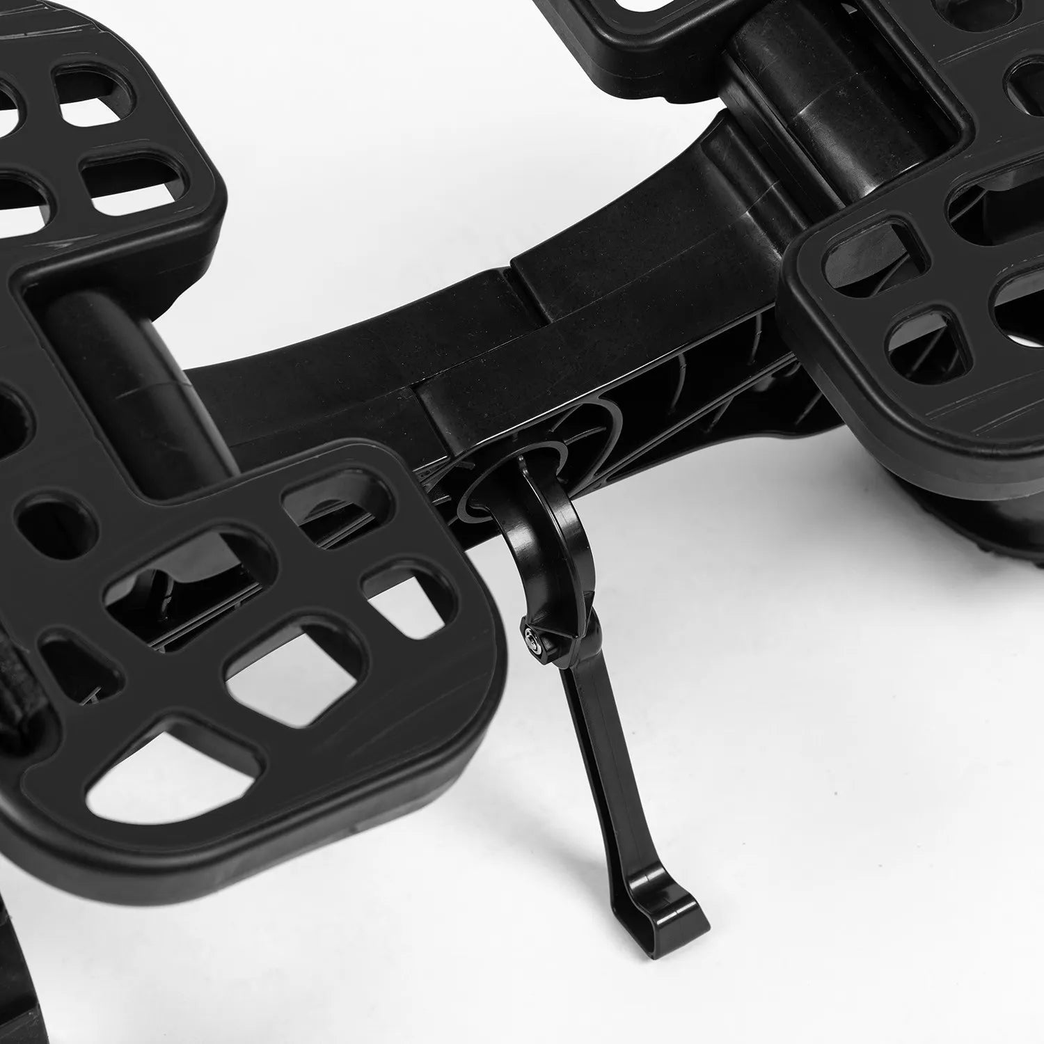 Close-up of a black metal bracket on a white background