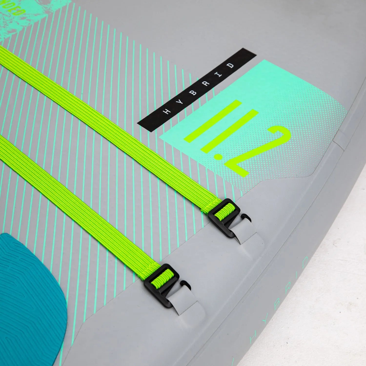 Close-up of a surfboard with green straps and 'Hybrid' branding on a white background