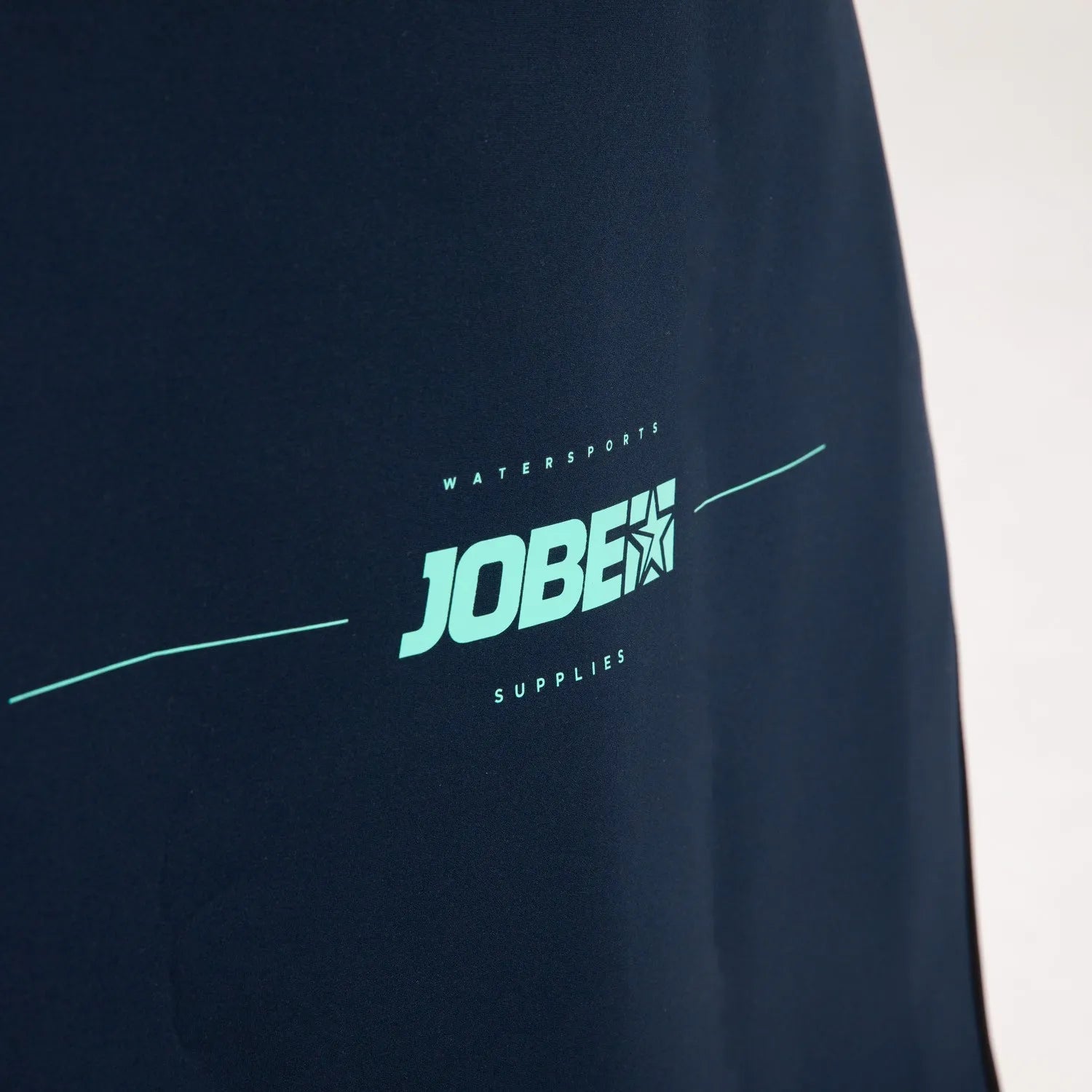 Navy blue sleeve with 'JOBE' logo on a white background
